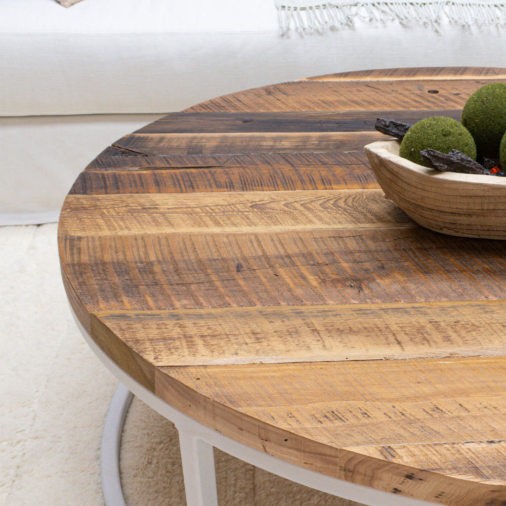 Large Round Reclaimed Wood Coffee Table with White Metal Base in Living Room